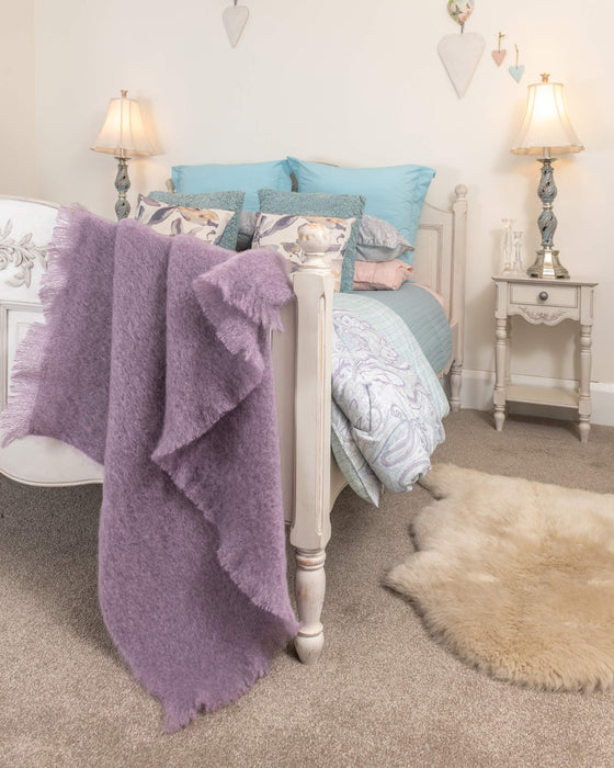 Amethyst mohair chair throw in a bedroom
