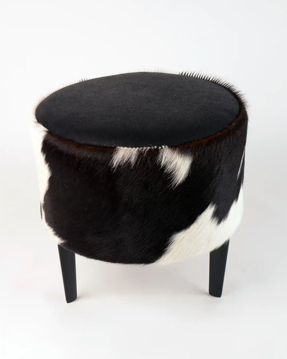 Small footstool in black and white cowhide