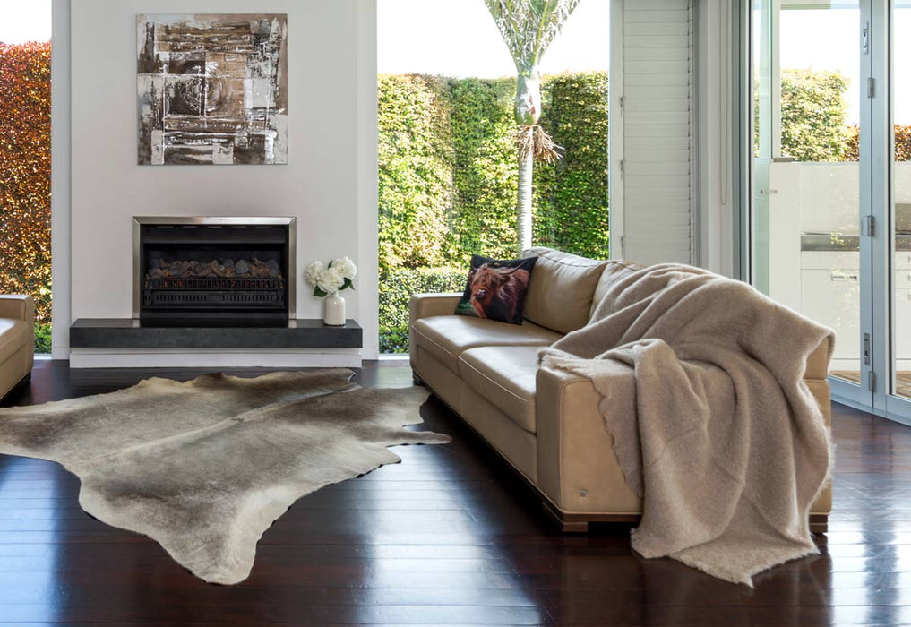 A Beige Mohair Blanket on a sofa