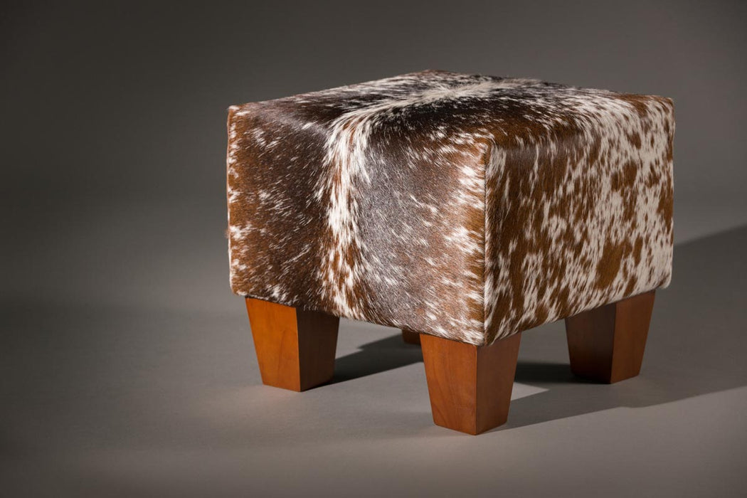 Cowhide footstool with wood legs