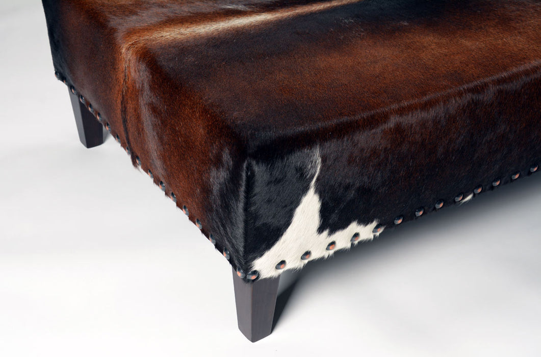 NZ cowhide ottoman copper studs