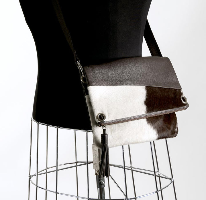 Brown and white cowhide handbag