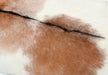 Brown and white goatskin rug close up