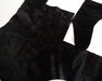 Black fur pelt hide laid flat for craft projects