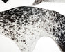 Cowhide rug scraps with a black and white speckled pattern, use for crafts.