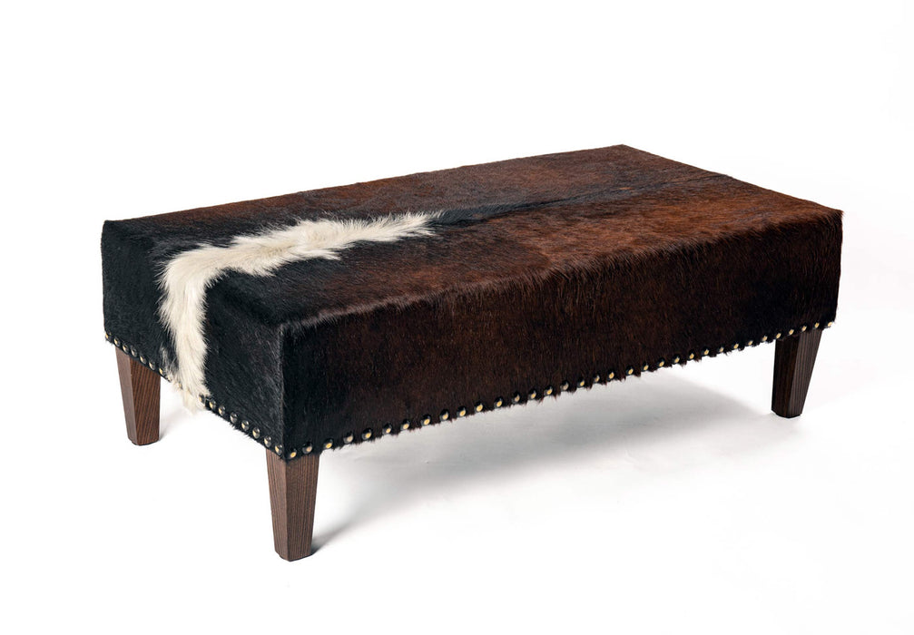 Cowhide ottoman USA with antique studs