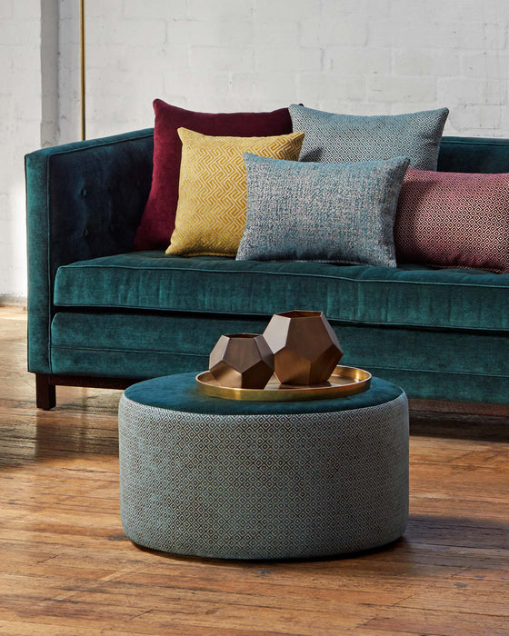 Mixed fabric round ottoman by Gorgeous Creatures