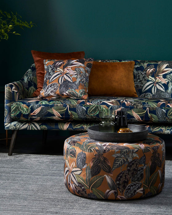 Round ottoman and sofa in Zanzibar velvet jungle fabric