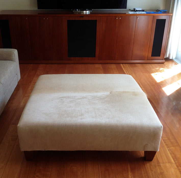 Square cowhide ottoman in beige cowhide