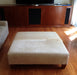 Square cowhide ottoman in beige cowhide