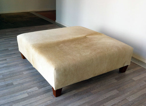 Square cowhide ottoman in beige cowhide