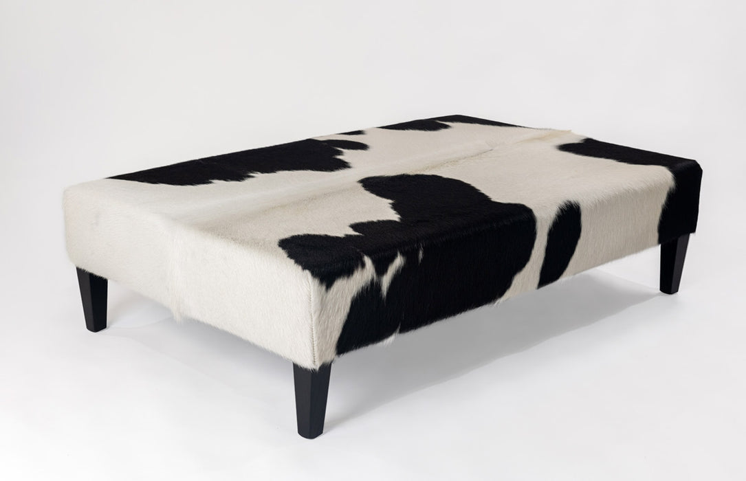 Very large black and white cowhide ottoman