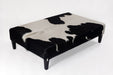 Very large black and white cowhide ottoman