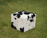 Black and white cowhide cube stool