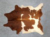 Cowhide rug rich chestnut brown and white