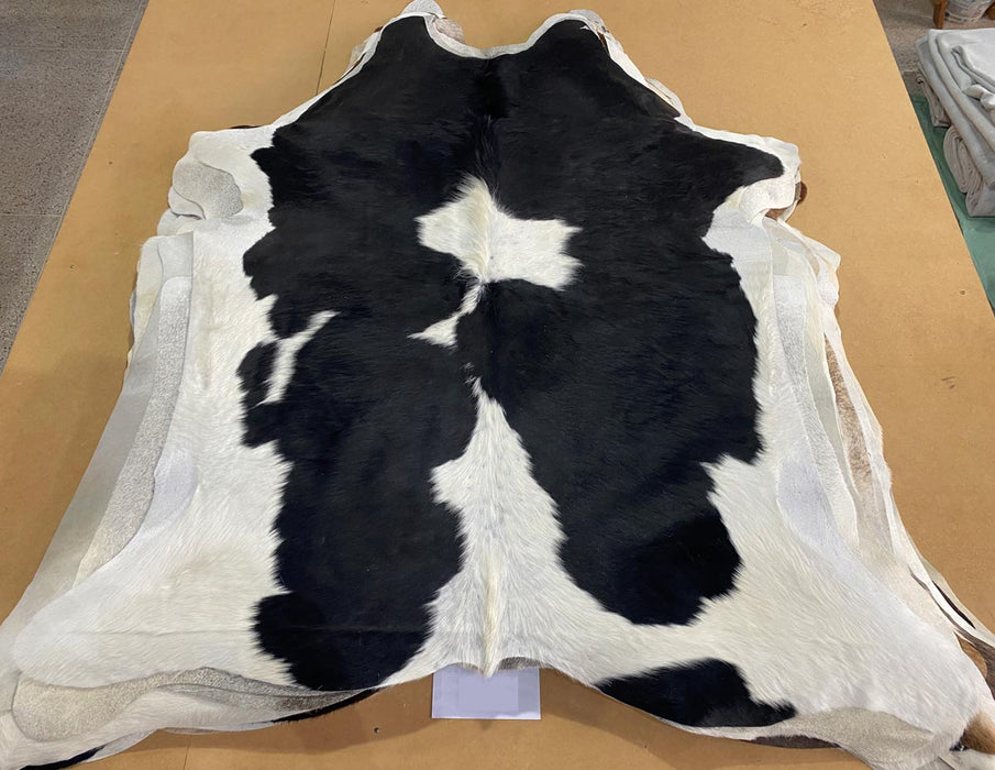 Small black and white cowhide rug
