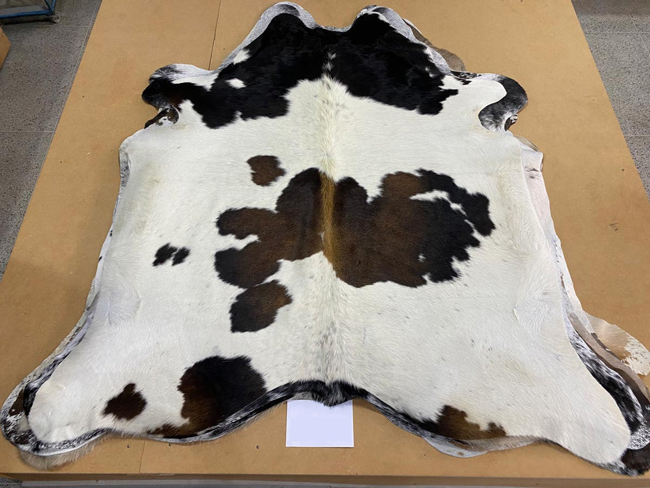 Chocolate brown and white cowhide rug