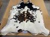 Speckled brown and white cowhide rug