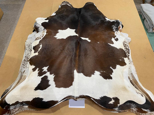 Rich chocolate brown & white cowhide rug