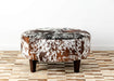 Speckled round cowhide ottoman with square legs