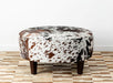 Speckled round cowhide ottoman with square legs