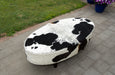 Brown and white oval cowhide ottoman by Gorgeous Creatures