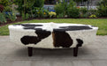 Brown and white oval cowhide ottoman by Gorgeous Creatures