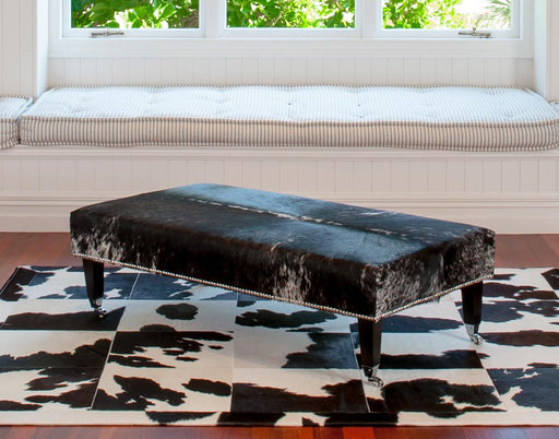 Cowhide Ottoman with Wood Legs 130x70x38cm Studs & Caster wheels