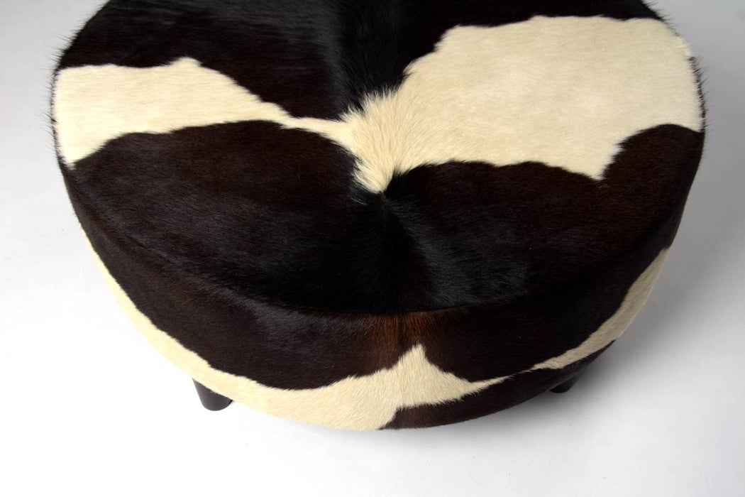 NZ cowhide ottoman round cream and chocolate