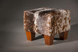 Cowhide footstool with wood legs