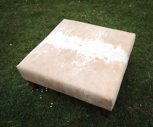 Square cowhide ottoman in beige and white cowhide