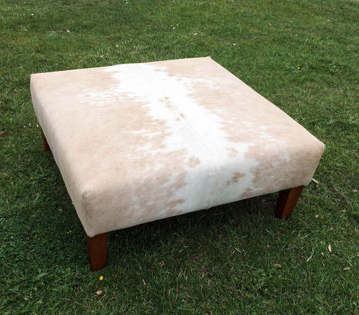 Square cowhide ottoman in beige and white cowhide