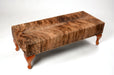 Cowhide ottoman with wood cabriole legs