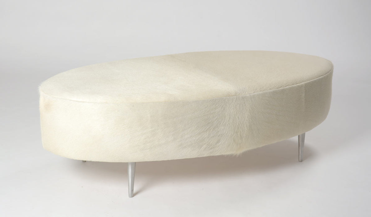 Off-white cowhide oval ottoman