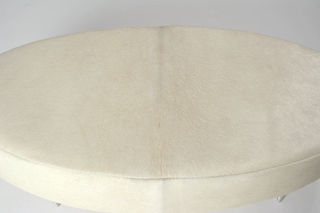 Off-white cowhide oval ottoman