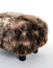 A cute chocolate wool sheepskin footstool