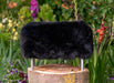 NZ black sheepskin footstool silver legs