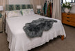 Grey Sheepskin Rug on bed NZ made