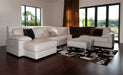 White cowhide ottoman in room setting