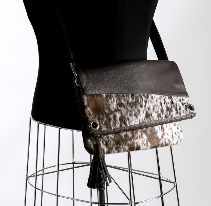 Brown and white cowhide handbag