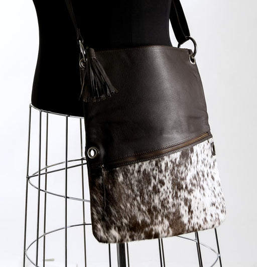 Brown and white cowhide handbag