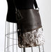 Brown and white cowhide handbag