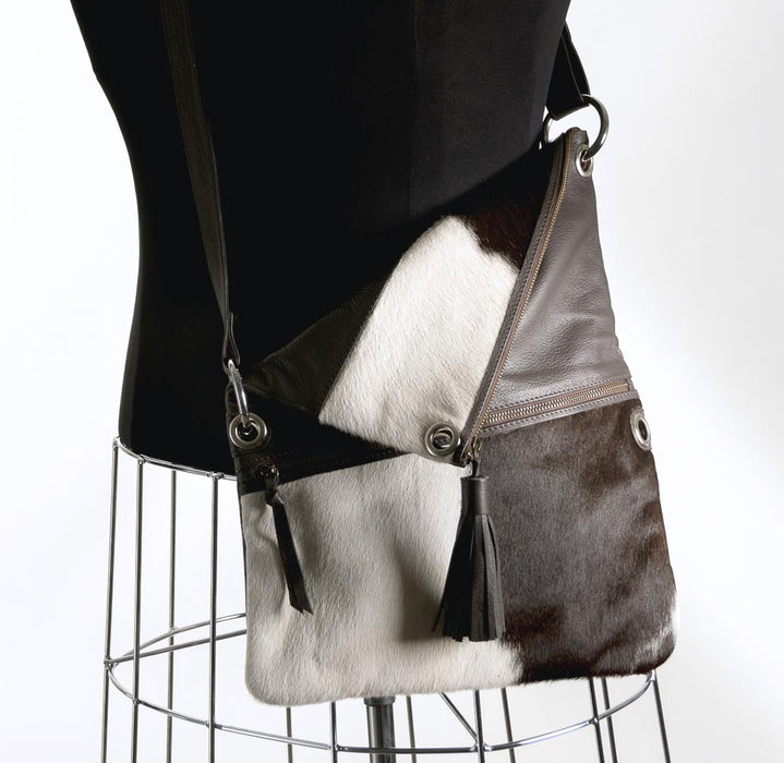 Brown and white cowhide handbag