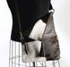 Brown and white cowhide handbag