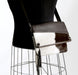 Brown and white cowhide handbag