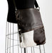 Brown and white cowhide handbag