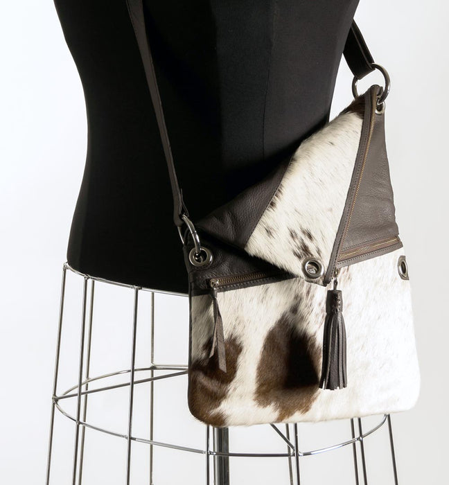 Brown and white cowhide handbag