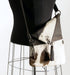 Brown and white cowhide handbag