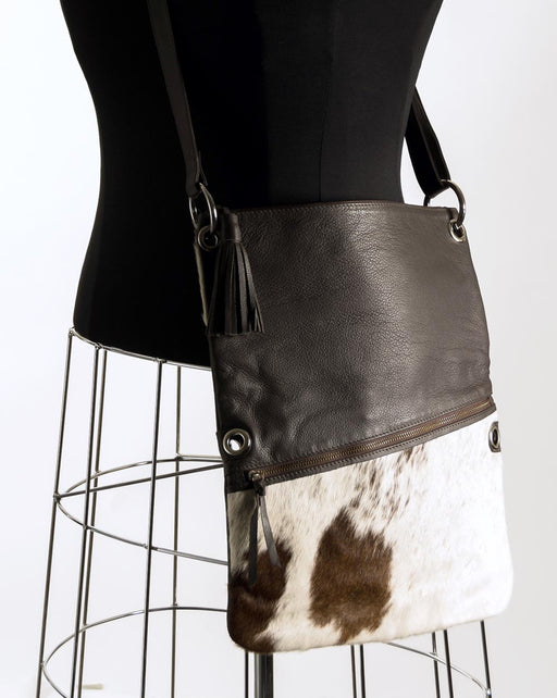 Brown and white cowhide handbag