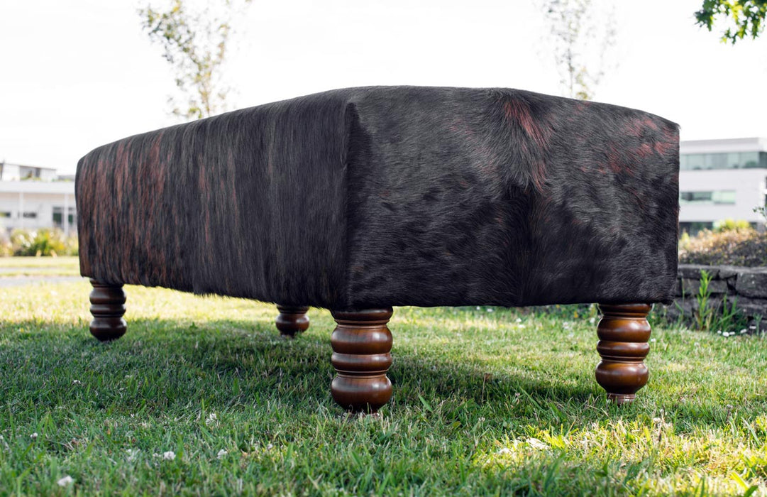 Cowhide Ottoman with Turned Wood Legs 138x60x50cm